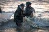 2 people catching fish in Alaska